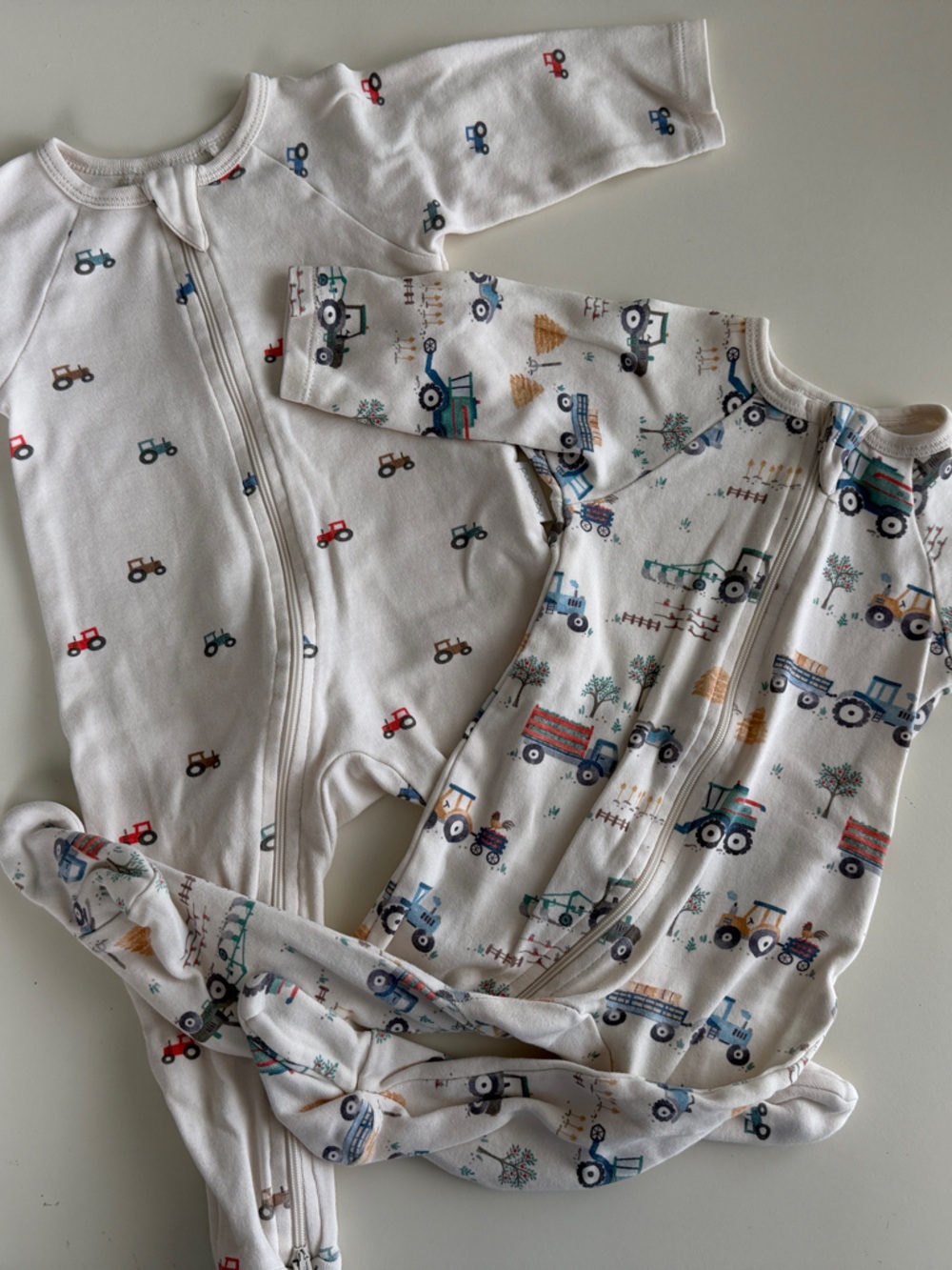 Purebaby White Footed One-Pieces with Multi-Colored Tractor Print